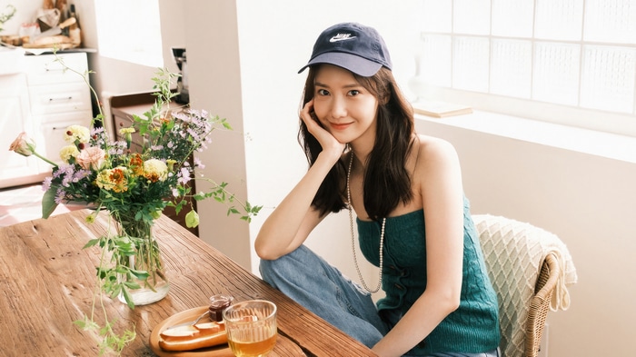 Yoona wearing a Nike cap and green top