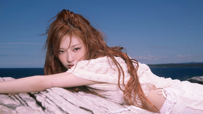 Ningning from Aespa on rocks by the sea