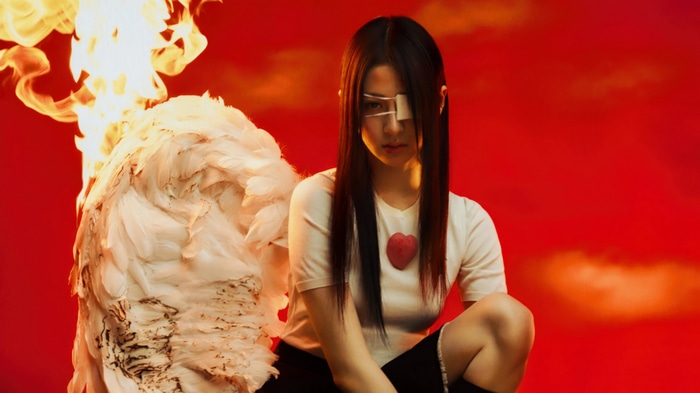 Huh Yun-jin with wings and fire