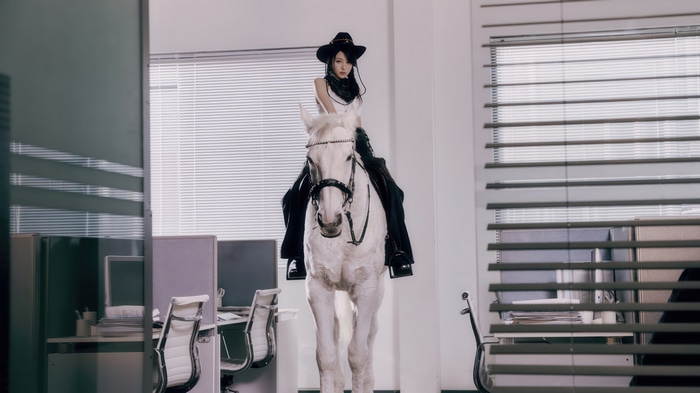 LE SSERAFIM Yunjin on a white horse in an office