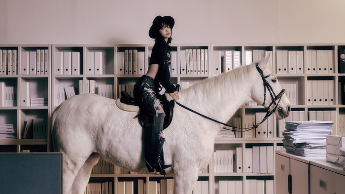 LE SSERAFIM Chaewon on a white horse in an office