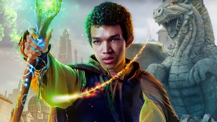 Justice Smith as a wizard with a dragon
