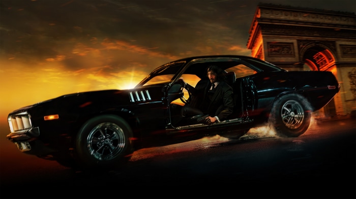 John Wick driving a car in Paris