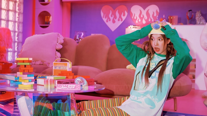 NMIXX Bae in a colorful room