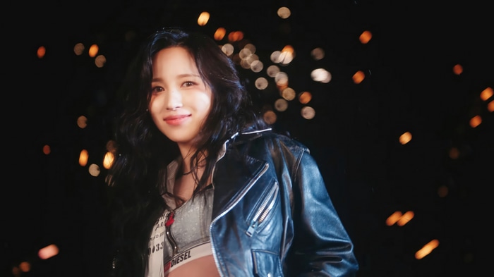 Mina from TWICE in a black leather jacket