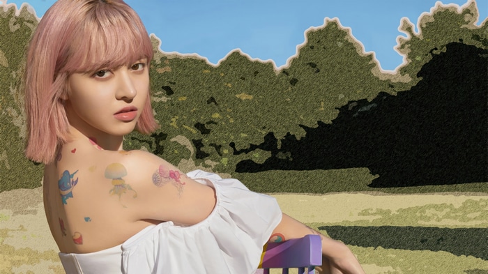 Lily from NMIXX with tattoos