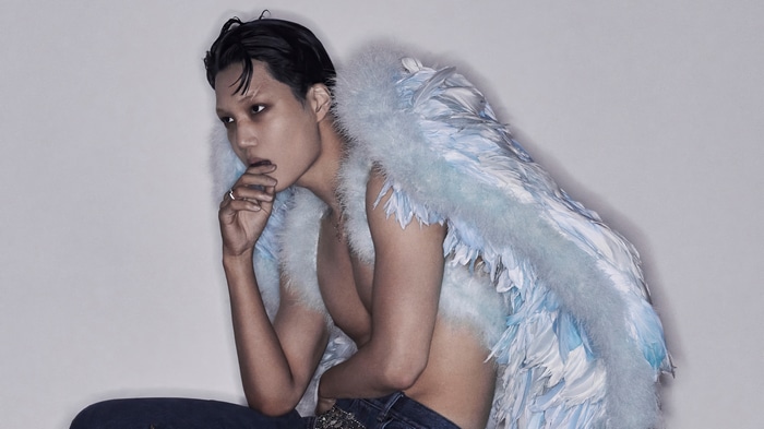 Kai from EXO with blue feathers