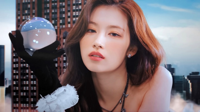 Sana from TWICE holds a crystal ball