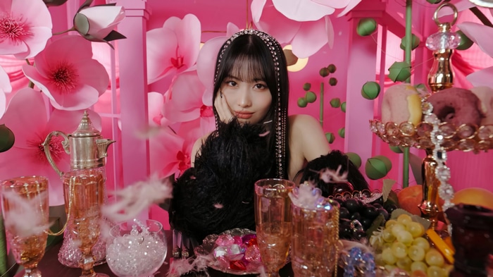 Momo from TWICE in a pink floral setting