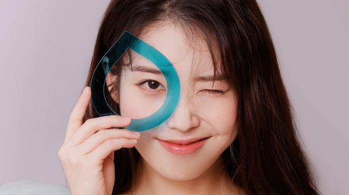 IU (Lee Ji-eun) holding a water drop shape