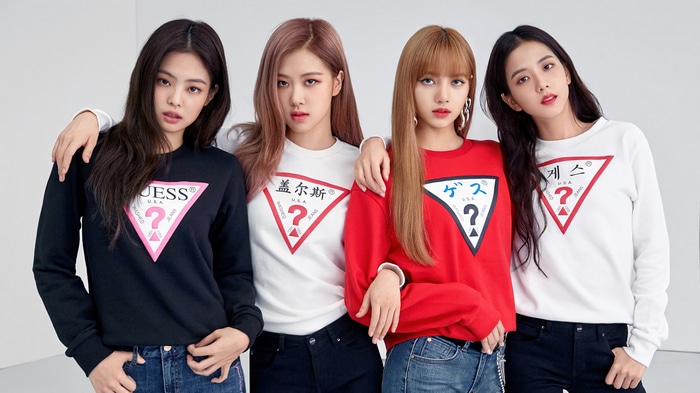 BLACKPINK members wearing Guess sweatshirts