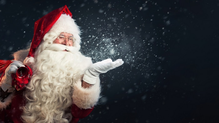 Santa Claus blowing snow in 4K