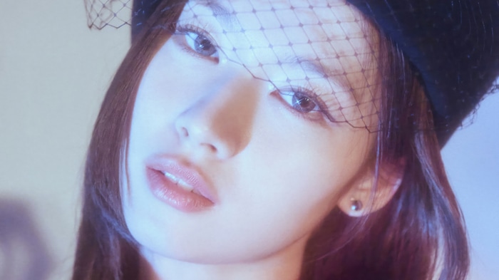 Sana from TWICE wearing a veil and hat