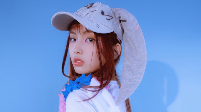 Hyein from NewJeans wearing a bunny hat