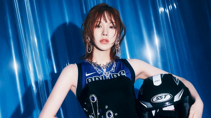 Wendy from GOT The Beat holding a helmet