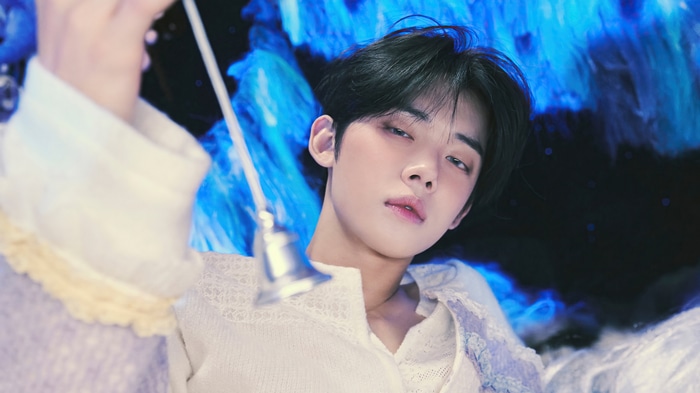 Yeonjun of TXT holding a bell