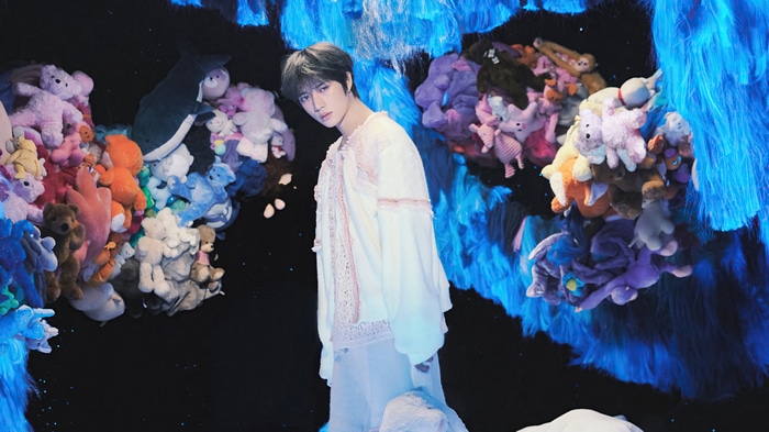TXT Beomgyu surrounded by plush toys