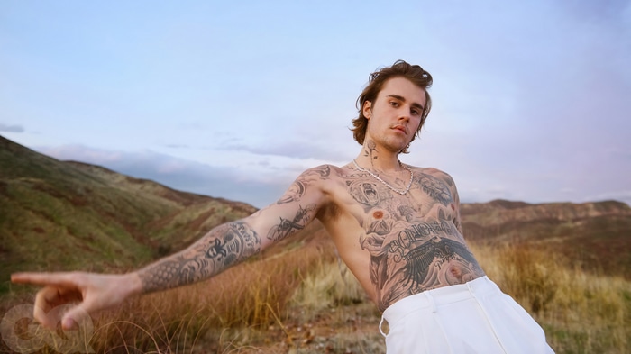 Justin Bieber shirtless in a photoshoot with tattoos
