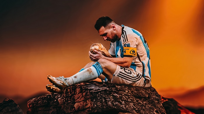 Lionel Messi holding the FIFA World Cup trophy