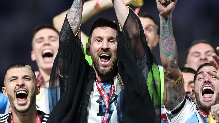 Lionel Messi celebrates with teammates after winning FIFA World Cup
