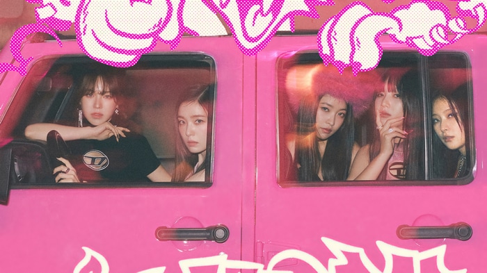 Red Velvet members in a pink jeep