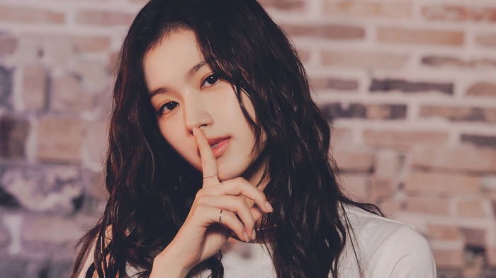 Sana from TWICE posing with finger to lips