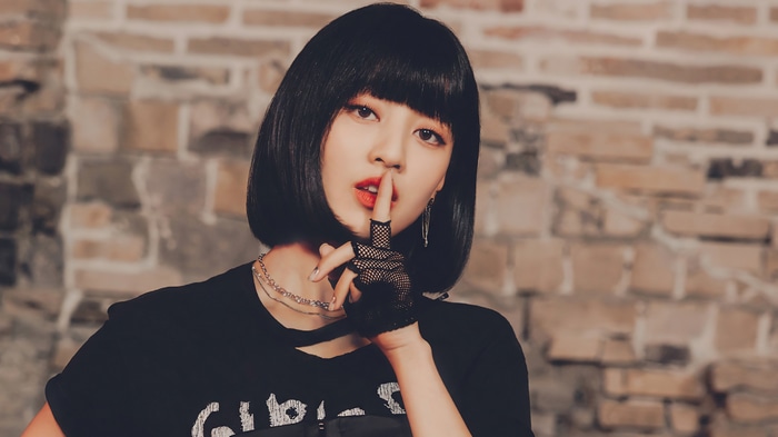 Jihyo of TWICE with a finger to her lips