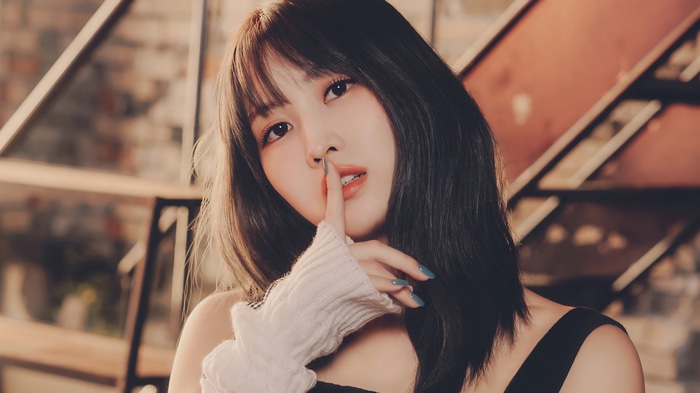Momo from TWICE with finger on lips