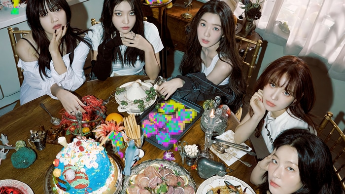 Red Velvet girls at a birthday party table