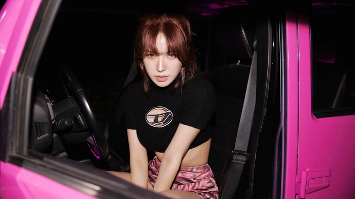 Wendy from Red Velvet in a pink car