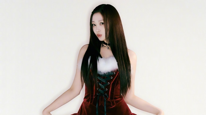 Giselle in a red Christmas outfit