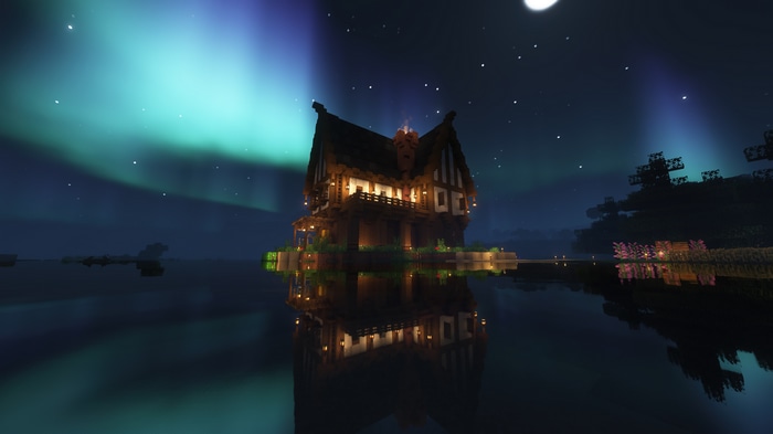 Minecraft house at night with aurora borealis
