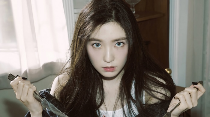 Irene holding a knife and fork