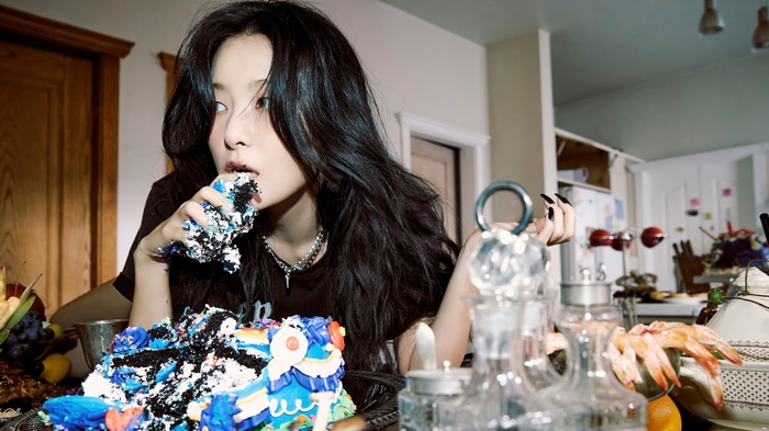 Seulgi eating a messy birthday cake