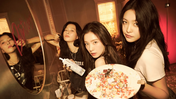Red Velvet Irene, Seulgi, and Yeri in a bathroom setting