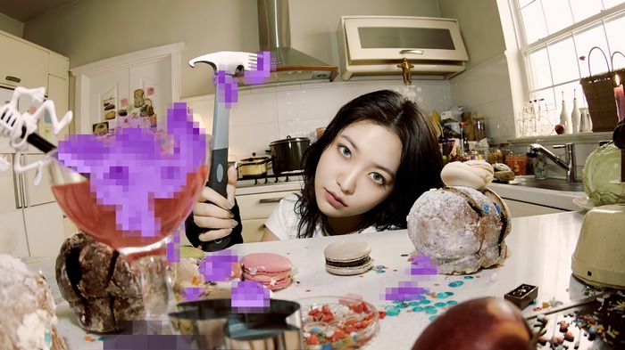 Yeri with a hammer in a kitchen