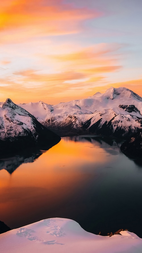 Garibaldi Lake at sunset with snowy mountains