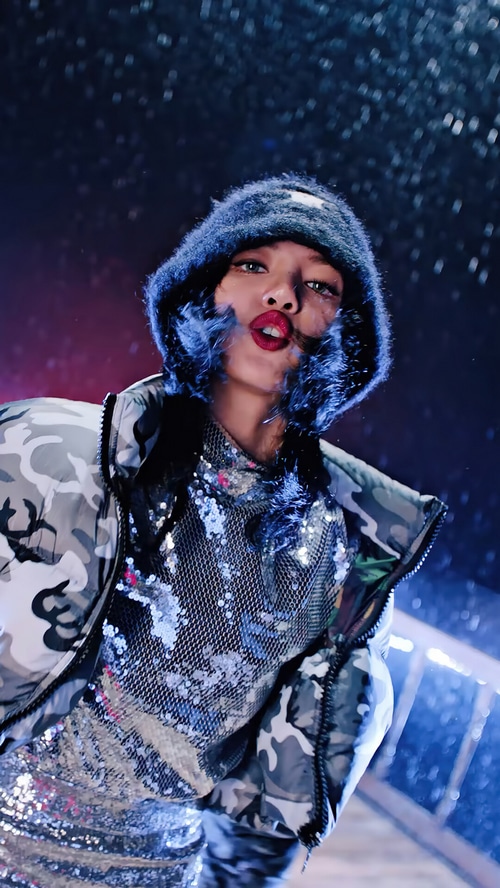 BLACKPINK Lisa in a fuzzy hat and sequin top