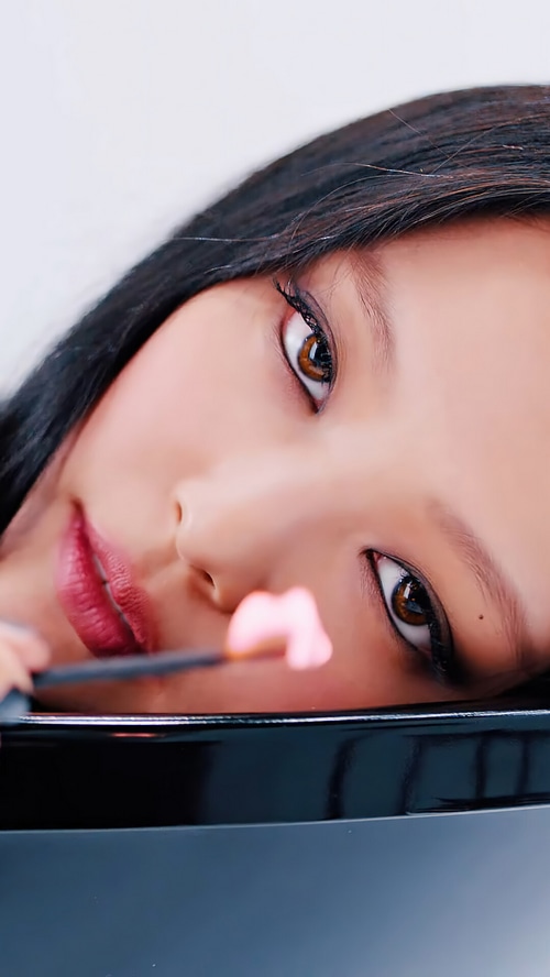 Jennie from BLACKPINK with pink object