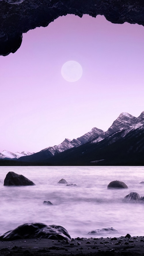 Mountain lake with moon and rocks