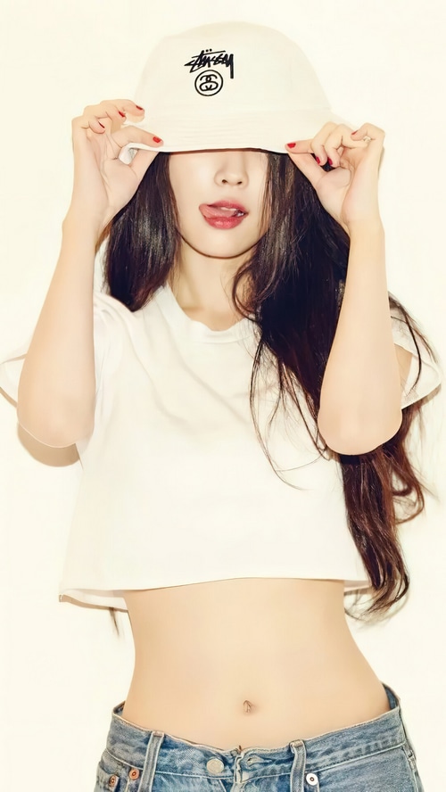 IU wearing a bucket hat and crop top
