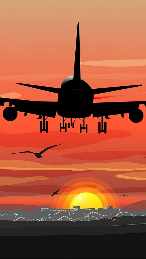 Airplane landing at sunset over a city