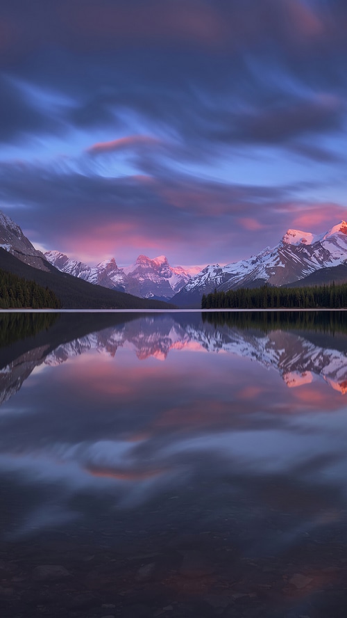 Lake and Mountains Reflected in Water at Sunset