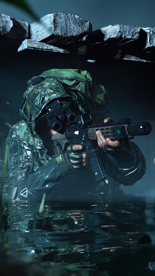 Soldier with night vision goggles and rifle in water