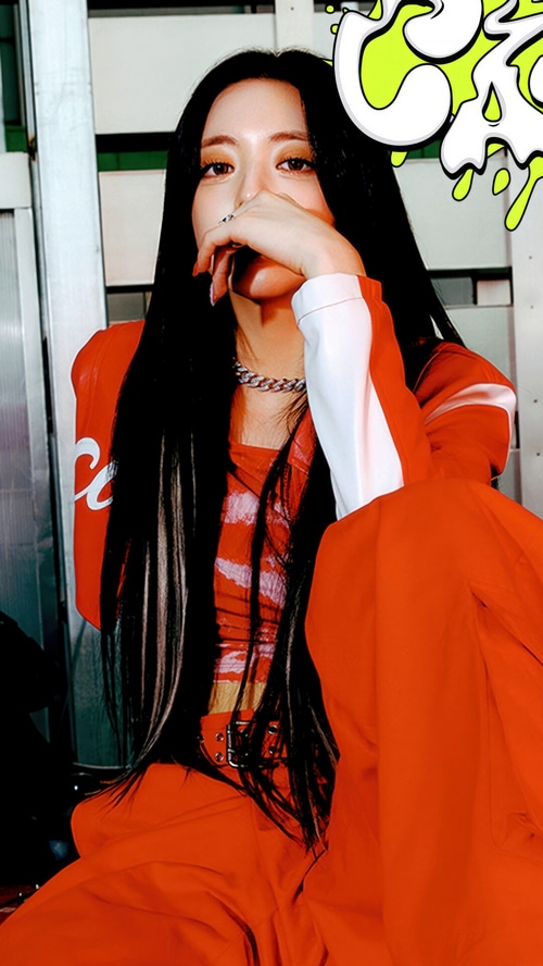 ITZY Yuna in Orange Outfit with CAKE Graphic