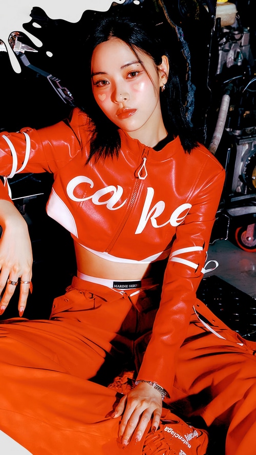 Shin Ryu Jin in a red outfit with 'CAKE' text