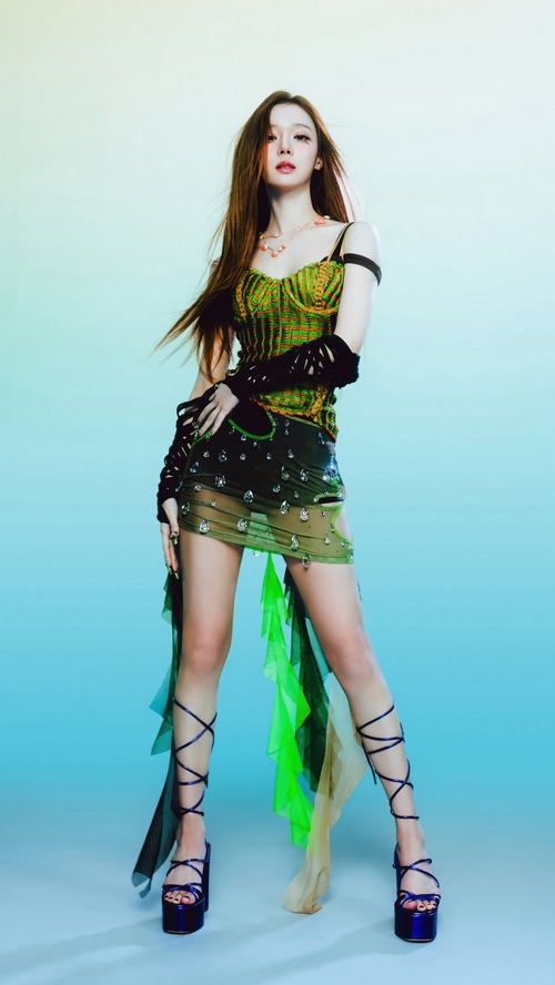 Winter from Aespa in a green outfit