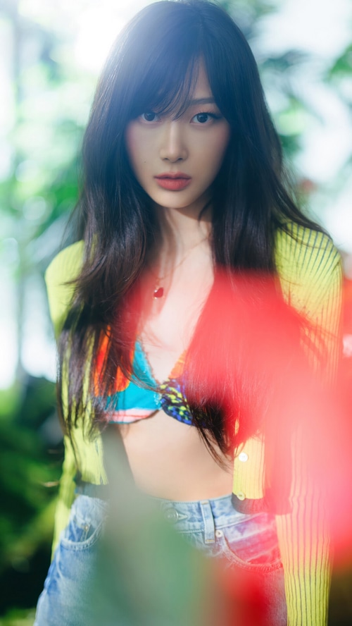 Giselle of Aespa in a colorful outfit