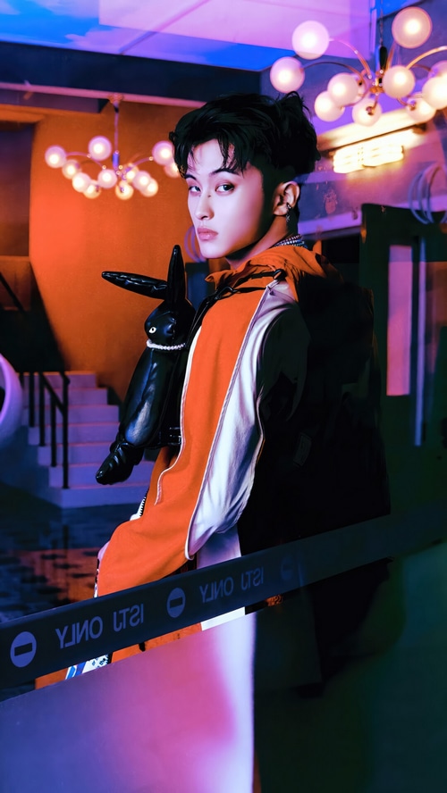 Mark from NCT DREAM with a black bunny bag