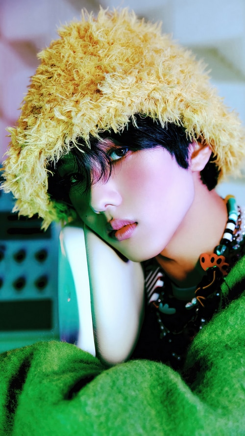 Jisung from NCT DREAM wearing a fluffy hat